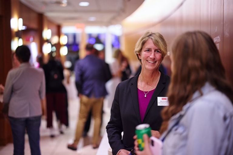 Dr. Ellen Faszewski speaking with someone at the 2022 Alumni Awards