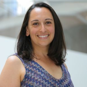 Photo of Rosie Norman, who is wearing a blue patterned sleeveless top.