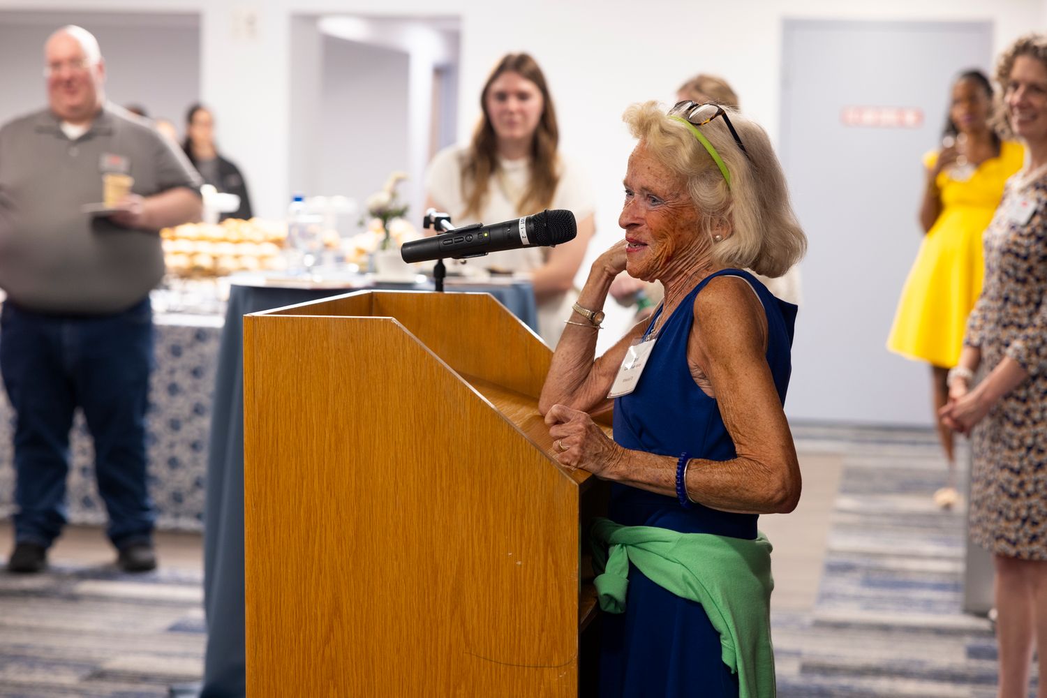 CAROL SULLIVAN-HANLEY speaking at a podium