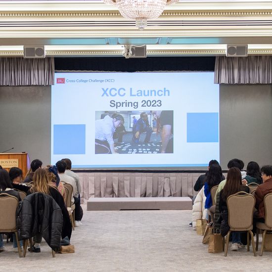 XCC students sit, focused on a screen projection during the launch.